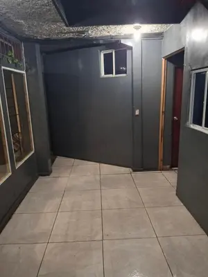 an empty room with a door and a tile floor at Mini apartamento familiar in San Salvador
