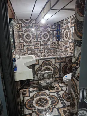 a bathroom with a sink and a toilet at Mini apartamento familiar in San Salvador