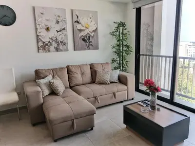 a living room with a couch and a coffee table at Un lugar especial en San Salvador in San Salvador