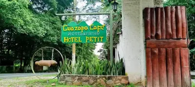 a sign on the side of a building at Guazapa Cafe hotel petit in Suchitoto