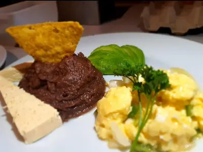 a plate of food with meat cheese and vegetables at Las Cabañitas, el boqueron in San Salvador
