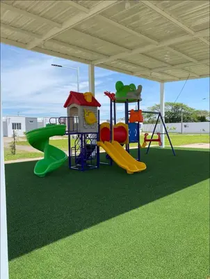 a playground with a slide and a play structure at Elegante casa a minutos de Centro comercial in San Miguel