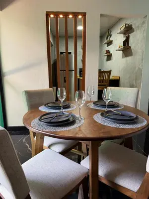 a wooden table with wine glasses on top of it at Casa Miralvalle in San Salvador