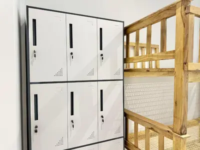 a closet with white lockers next to a staircase at Sunzal Surf Garden - El Tunco in Tamanique
