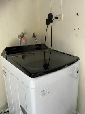 a glass counter top on top of a washing machine at Casa Virginia, AC, Close to Downtown, Private in Santa Ana