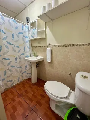 a bathroom with a toilet and a sink at Casa Virginia, AC, Close to Downtown, Private in Santa Ana