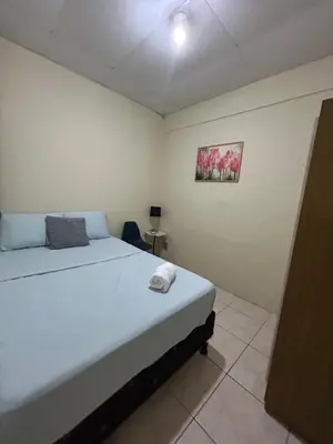 a bedroom with a large bed in a room at Casa Virginia, AC, Close to Downtown, Private in Santa Ana