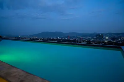 a swimming pool with a view of a city at Apartment With Pool In Colonia Escalon in San Salvador