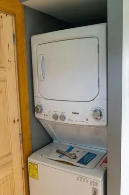 a microwave sitting on top of a refrigerator at Dreamy cabin in Comasagua, La Libertad in Comasagua