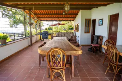 a wooden table and chairs on a patio at Monticello in San Marcos