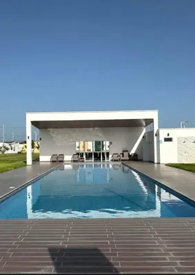 a large swimming pool on top of a building at Golden House in San Miguel