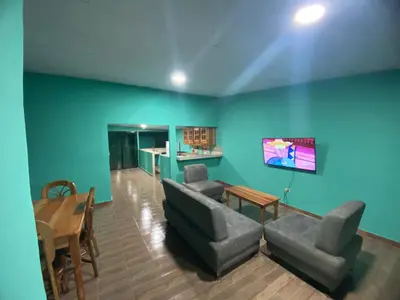 a living room with a couch and a table at Casa Apaneca in Apaneca