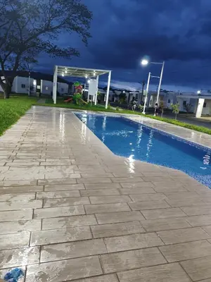 a swimming pool in a yard at night at Luxury Living Apartment P1001 in San Miguel