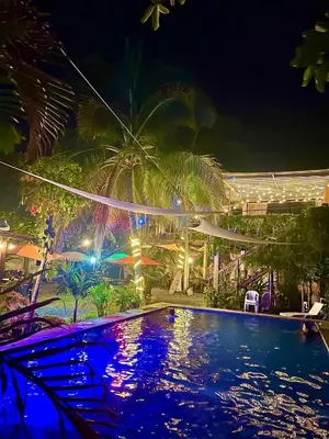 a swimming pool at night with a resort at Copacabana SV L in El Majahual