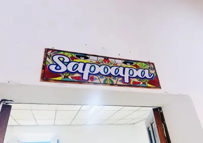 a sign on the top of a building at Hostal Los Milagros in Santa Ana
