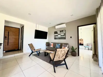 a living room with a couch and a table at Casa de lujo- Vista- Piscina- La Libertad in La Libertad