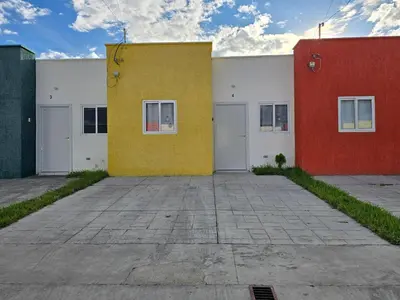 a group of buildings with different colored at Casa en Villa Panamericana, San Miguel in San Miguel
