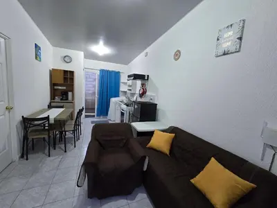 a living room with a couch and a table at Casa en Villa Panamericana, San Miguel in San Miguel