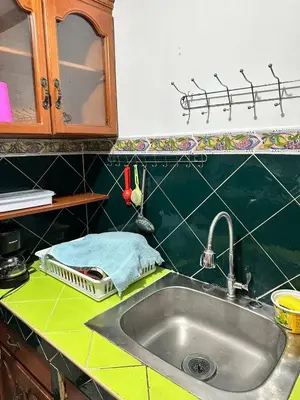 a kitchen counter top with a sink and a counter top at Tu Estancia en San Salvador in Mexicanos