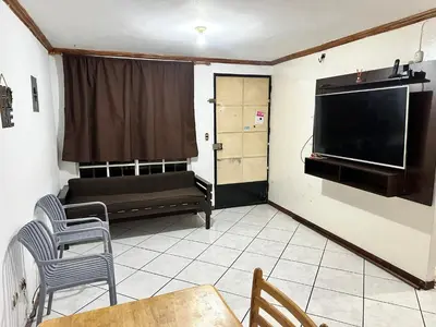 a living room with a flat screen tv and a couch at Tu Estancia en San Salvador in Mexicanos