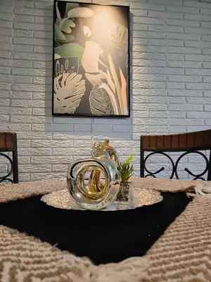 a table with a gold bowl on top of it at Cozy & Modern Condo In the Heart of San Salvador in San Salvador
