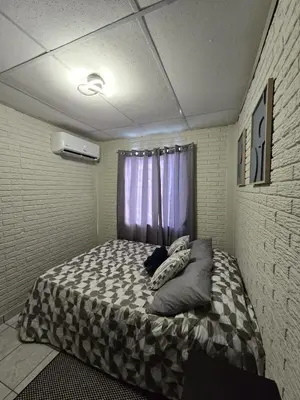 a bedroom with a bed in a room at Cozy & Modern Condo In the Heart of San Salvador in San Salvador