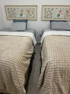 two beds sitting next to each other in a room at Descanso San Miguel in San Miguel