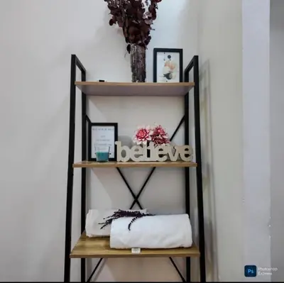 a shelf with a sign that says believe at Suite para dos Las Terrazas in San Salvador