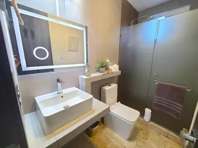 a bathroom with a sink and a toilet and a shower at Jasibe Oceanside in Amatecampo - Steps to beach - Flexible Checkout in El Porvenir