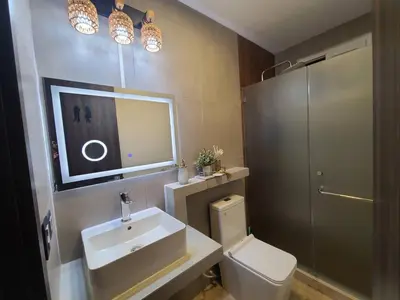 a bathroom with a sink and a toilet and a mirror at Jasibe Oceanside in Amatecampo - Steps to beach - Flexible Checkout in El Porvenir