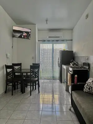 a kitchen and dining room with a table and chairs at Tu lugar tranquilo cerca de todo in San Miguel
