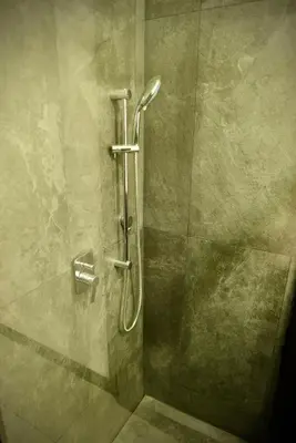 a shower with a glass door in a bathroom at Stylish apartment in San Salvador Downtown in San Salvador