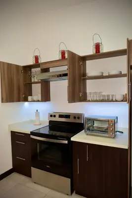 a kitchen with a stove and a toaster oven at Stylish apartment in San Salvador Downtown in San Salvador
