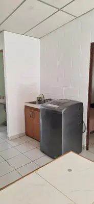 a kitchen with a sink and a counter in a room at Casa El Trébol