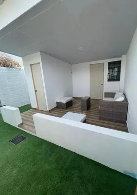a living room with a couch and a table at Casa El Trébol
