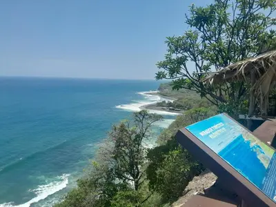 a view of the ocean with a sign at Apt Playa kilometro 59, Rural area in ChiltiupÃ¡n