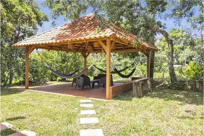 a gazebo with a hammock and a swing at Comfy Bedroom in a hostal at Coatepeque lake in El Congo