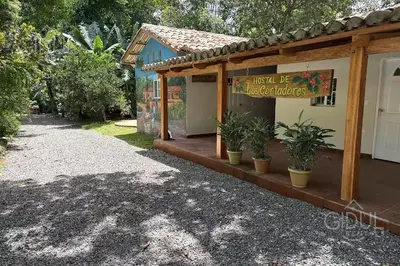 a building with a sign that reads just be miracles at Cozy Bedroom in a coffee farmn in Coatepeque Lake in Santa Ana
