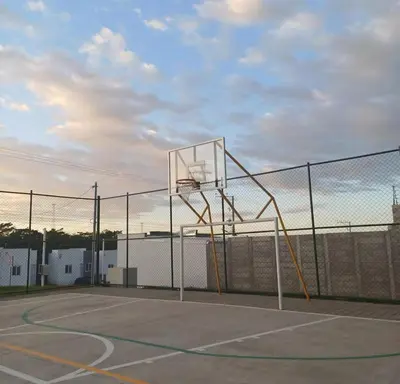 a basketball hoop on a tennis court at Ahuachapan Tiny Rental Homes in Ahuachapán