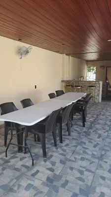 a large white table in a room with chairs at Rancho número 50 in La Libertad