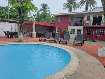 a swimming pool in front of a house at Rancho número 50 in La Libertad