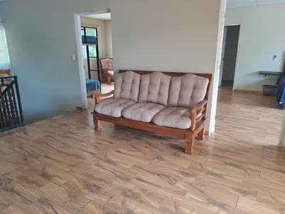 a couch sitting in the middle of a living room at Rancho número 50 in La Libertad