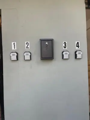 a wall with clocks with numbers on it at Conchita House Playa El Tunco in Tamanique