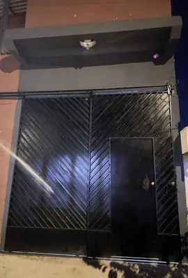 a front door of a building with black metal at Mini Apartamento in Nueva San Salvador