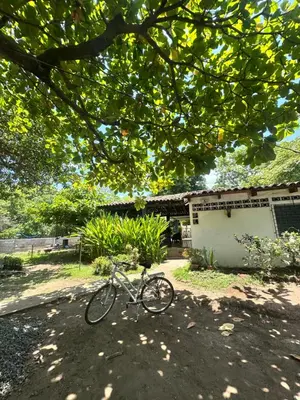 a bike parked in front of a house at Surfcity Townhouse in La Libertad