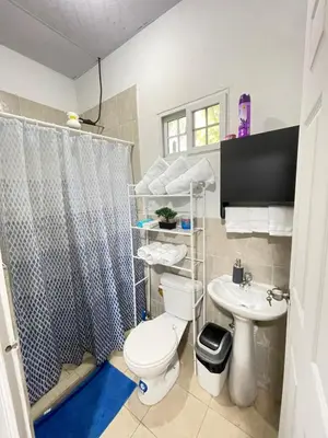 a bathroom with a toilet and a sink at La ceiba surf in El Sunzal