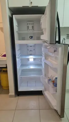 an empty refrigerator with its door open in a kitchen at Cozy House! San Miguel in San Miguel
