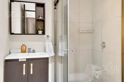 a bathroom with a shower and a sink and a mirror at Great San Salvador views at Los Planes wifi and Ac in San Salvador