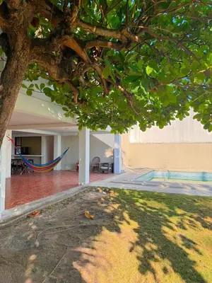 a tree with a hammock in the middle of a house at Villa Vallarta Costa del Sol in Marcelino