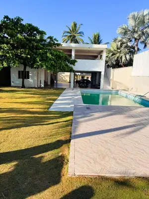 a house with a swimming pool in front of it at Villa Vallarta Costa del Sol in Marcelino